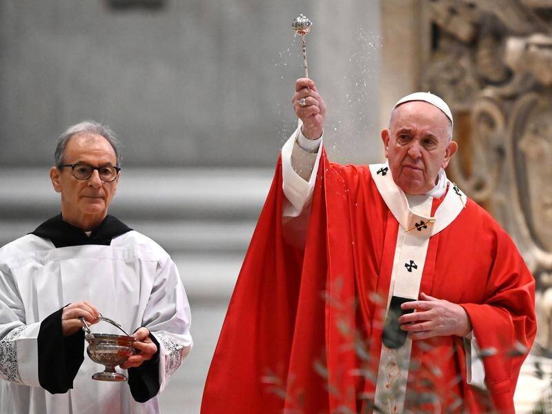 The coronavirus has forced the Pope to conduct Palm Sunday Mass behind closed doors.