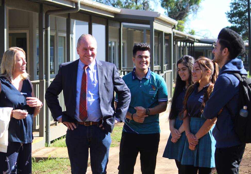 MEETING: Sarah Mills from Armidale Secondary College with Member for New England Barnaby Joyce and a group of Yezidis students.