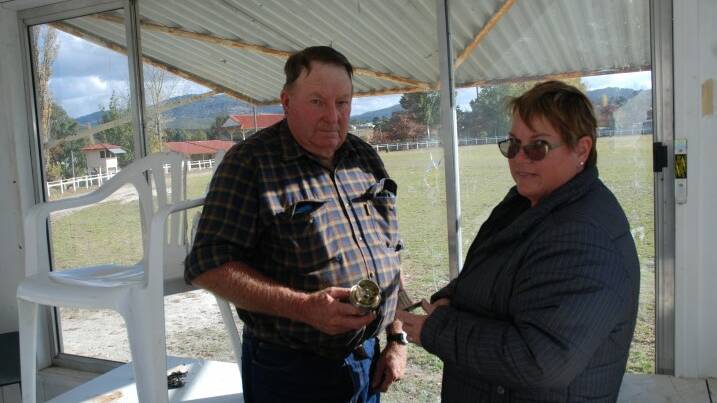 LOOKING FOR ANSWERS: Bruce Petrie and Kim Rhodes, from the showground trust and show society, are frustrated at the senseless damage.