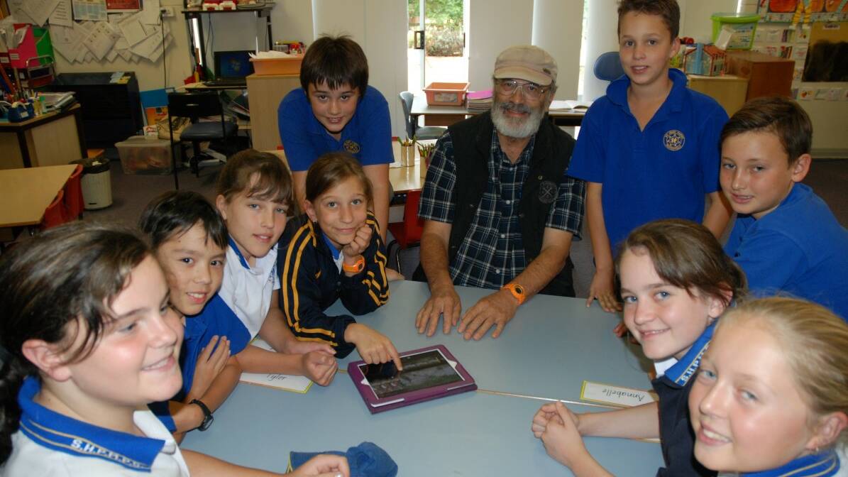Communication tool: Peter Harris discusses the finer points of storytelling using digital technology with Sir Henry Parkes Memorial School Year 5 and 6 students (clockwise, from Peter) Fletcher Koch, Toby Lieberman, Anika Rossington, Zoe Nalder, Tatyana Cook, James Ibbett, Nessa Butler, Renee Jenkins and Ralph Thomson.