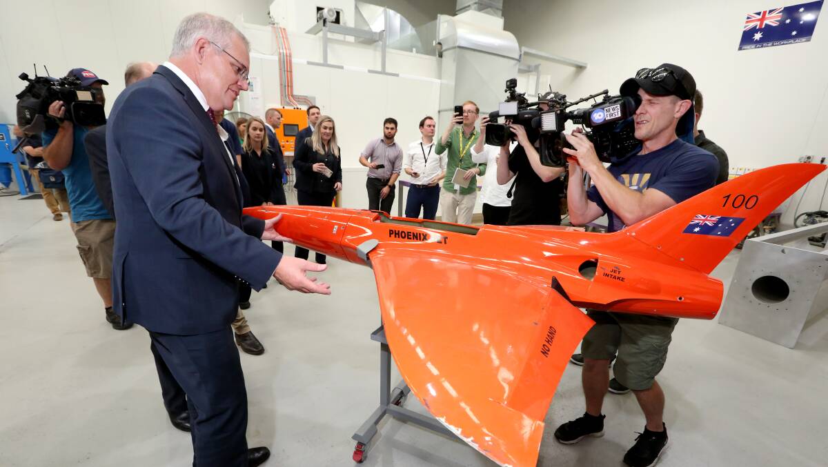 The Prime Minister inspects a drone at Air Affairs Australia's advanced manufacturing centre in South Nowra. Picture: James Croucher