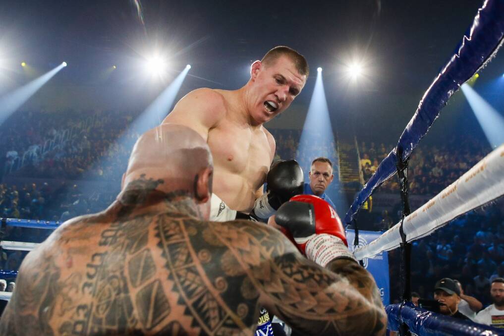 ON THE CANVAS: Paul Gallen drops Lucas Browne to the canvas at the WIN Entertainment Centre on Wednesday night. Picture: Adam McLean. 